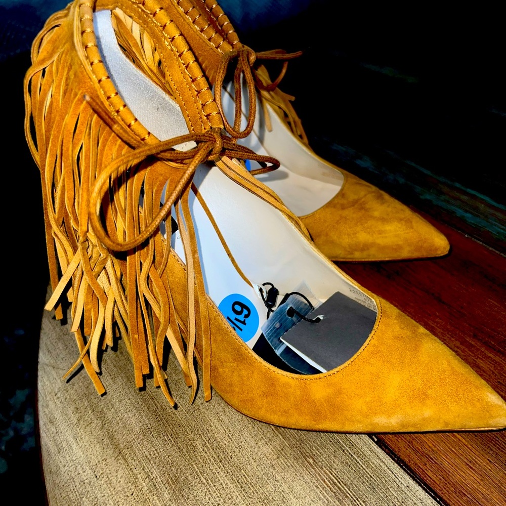 Women’s 4 inch suede pumps with fringe and ankle tie.